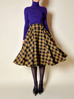 Jupe évasée en laine à motif damier jaune et noir