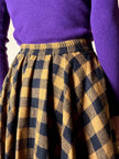 Jupe évasée en laine à motif damier jaune et noir