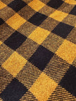 Jupe évasée en laine à motif damier jaune et noir