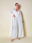 Jumpsuit color perla con corpetto trapuntato in raso “Maby Pyeard” disegnato da Renato Balestra