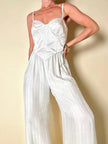 Jumpsuit color perla con corpetto trapuntato in raso “Maby Pyeard” disegnato da Renato Balestra