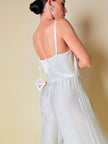 Jumpsuit color perla con corpetto trapuntato in raso “Maby Pyeard” disegnato da Renato Balestra