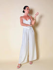 Jumpsuit color perla con corpetto trapuntato in raso “Maby Pyeard” disegnato da Renato Balestra