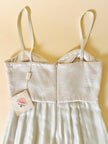 Jumpsuit color perla con corpetto trapuntato in raso “Maby Pyeard” disegnato da Renato Balestra
