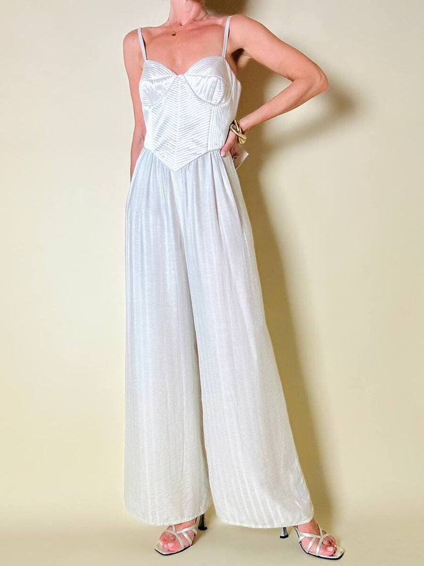 Jumpsuit color perla con corpetto trapuntato in raso “Maby Pyeard” disegnato da Renato Balestra