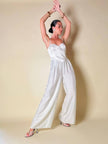 Jumpsuit color perla con corpetto trapuntato in raso “Maby Pyeard” disegnato da Renato Balestra