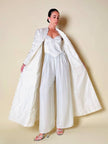 Jumpsuit color perla con corpetto trapuntato in raso “Maby Pyeard” disegnato da Renato Balestra
