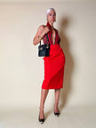 Longuette rossa con abbottonatura posteriore “Yves Saint Laurent”