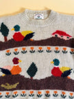 Maglione in lana écru fantasia papere 