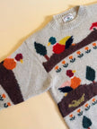 Maglione in lana écru fantasia papere 