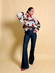 Maglione in lana écru fantasia papere 