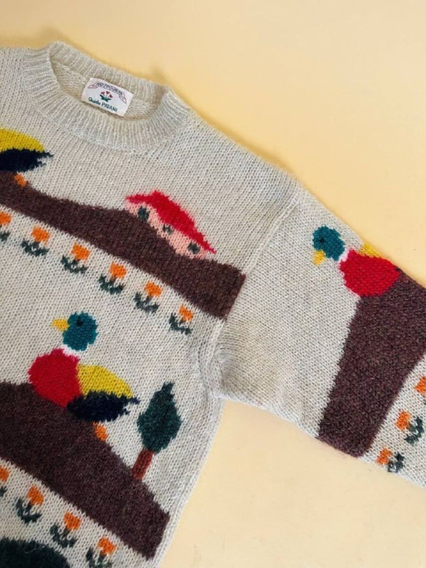 Maglione in lana écru fantasia papere 