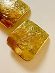 Maxi clip oro con logo “Yves Saint Laurent”