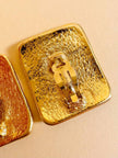 Maxi clip oro con logo “Yves Saint Laurent”
