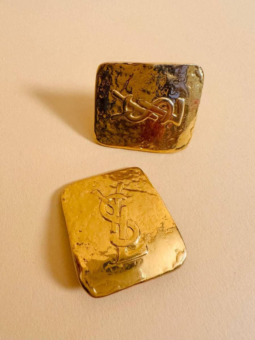 Maxi clip oro con logo “Yves Saint Laurent”