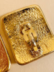 Maxi clip oro con logo “Yves Saint Laurent”