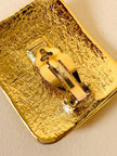 Maxi clip oro con logo “Yves Saint Laurent”