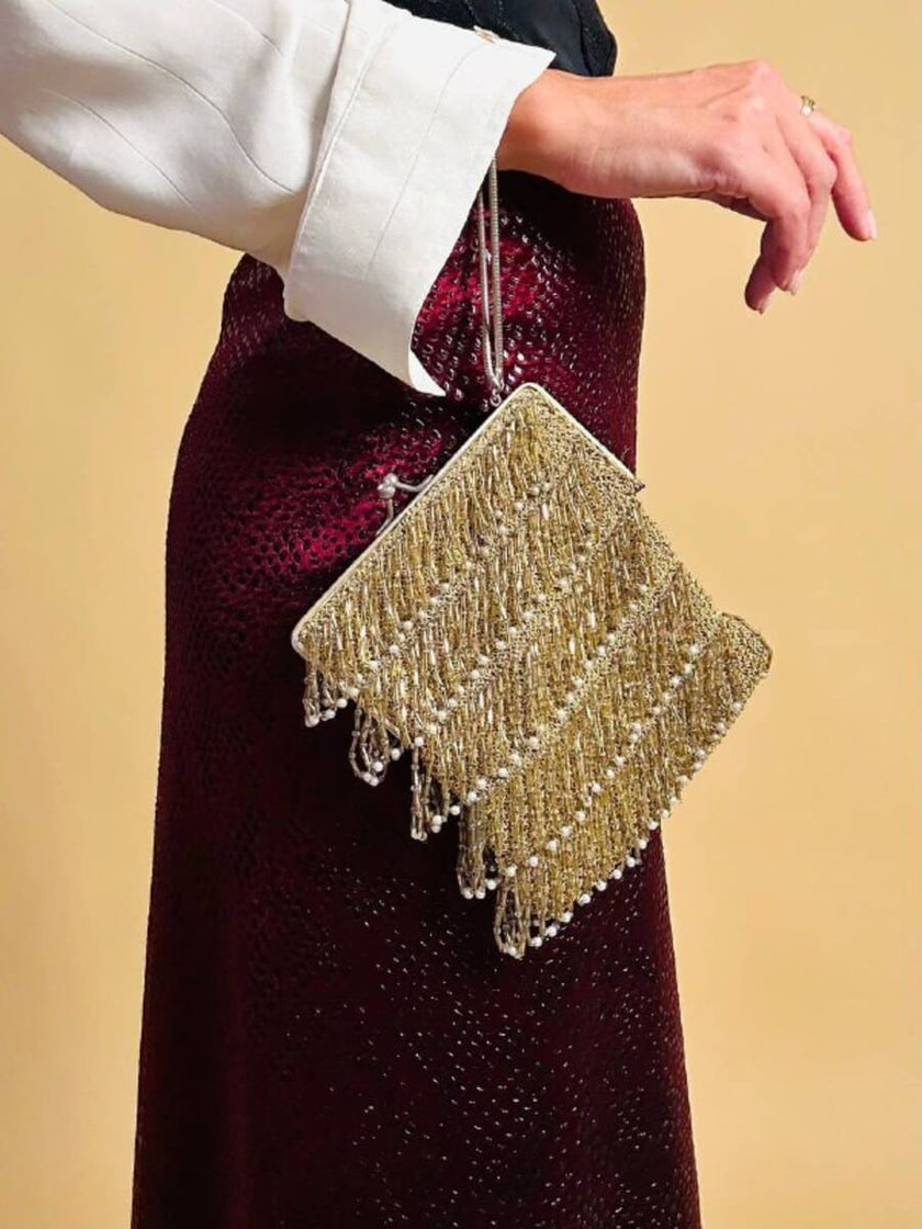 Mini bag in crochet oro con frange di perline