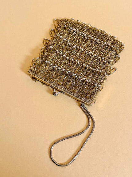 Mini bag in crochet oro con frange di perline