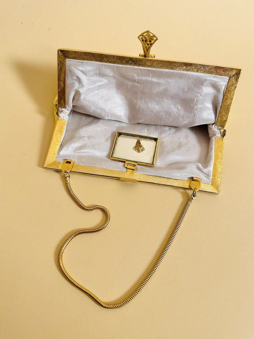 Mini bag in pelle laminata oro con specchietto incorporato