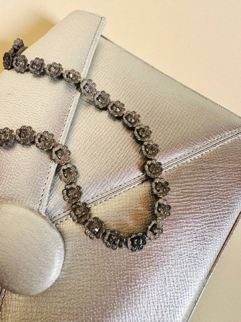 Mini bag in pelle argento con manico gioiello