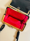 Mini bag artigianale in pitone nero con fodera rossa