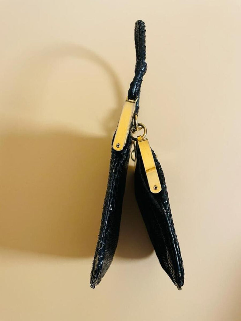 Mini bag artigianale in pitone nero con fodera rossa