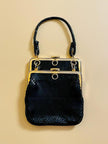 Mini bag artigianale in pitone nero con fodera rossa