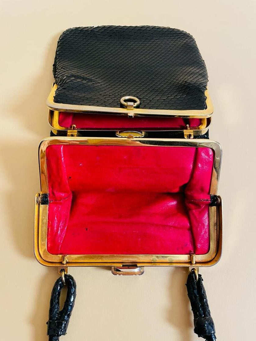 Mini bag artigianale in pitone nero con fodera rossa