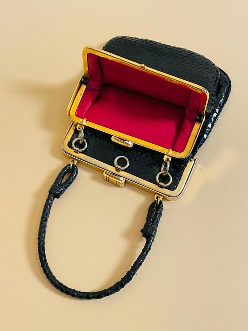 Mini bag artigianale in pitone nero con fodera rossa