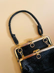 Mini bag artigianale in pitone nero con fodera rossa