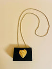 Mini bag a tracolla in raso nero con maxi cuore oro