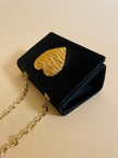 Mini bag a tracolla in raso nero con maxi cuore oro