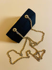 Mini bag a tracolla in raso nero con maxi cuore oro