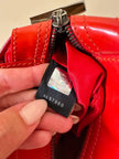 Mini bag in vernice arancione con logo in specchio argento “Fendi”
