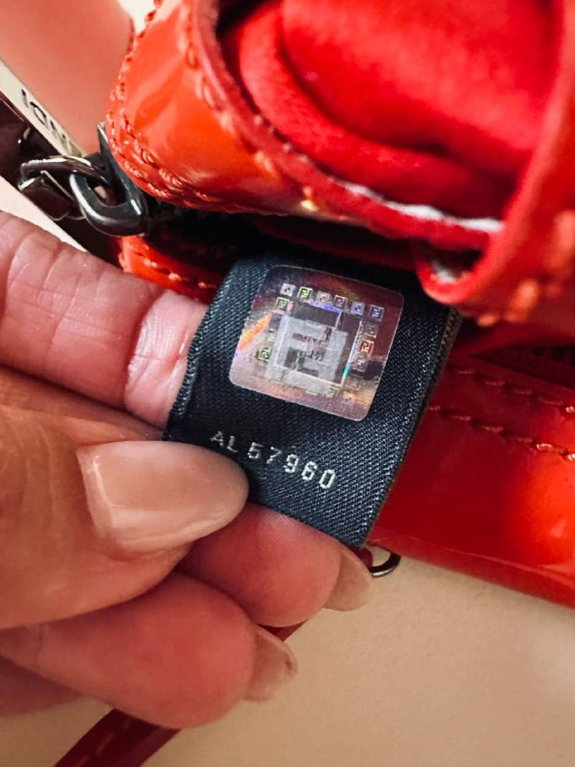 Mini bag in vernice arancione con logo in specchio argento “Fendi”