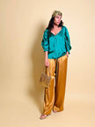 Pantalone a palazzo in cady lucido color ambra 