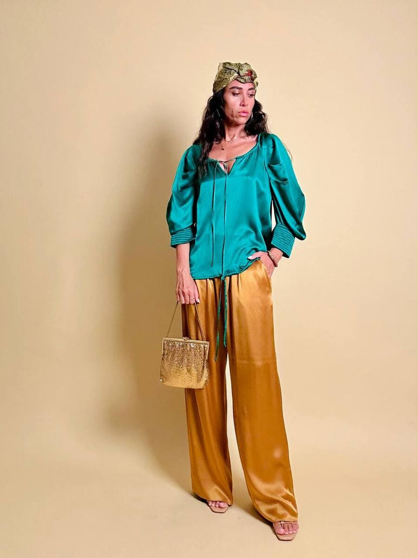 Pantalone a palazzo in cady lucido color ambra 