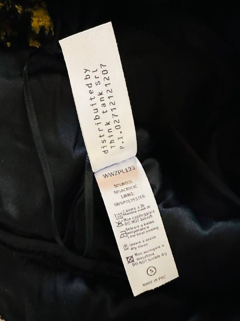 Pantalone a palazzo giallo e nero in lana bouclé fantasia pied de coque “Weili Zheng”