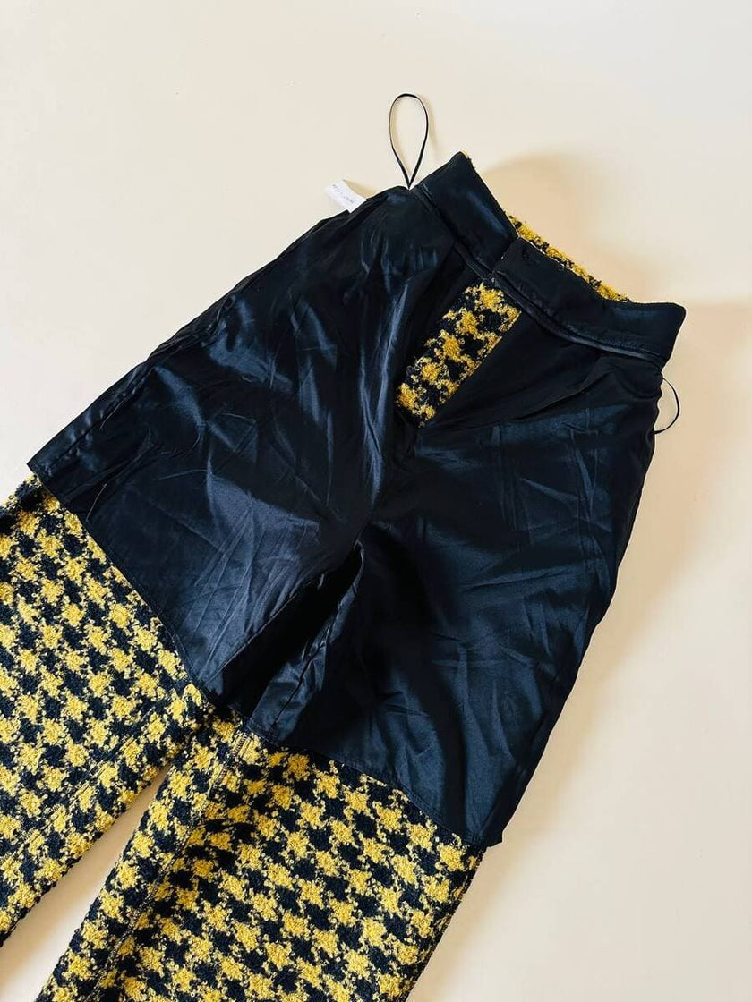 Pantalone a palazzo giallo e nero in lana bouclé fantasia pied de coque “Weili Zheng”