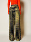 Pantalone a palazzo giallo e nero in lana bouclé fantasia pied de coque “Weili Zheng”