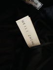 Pantalone a palazzo giallo e nero in lana bouclé fantasia pied de coque “Weili Zheng”