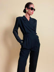 Smoking jumpsuit nera con bottoni dorati