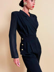 Smoking jumpsuit nera con bottoni dorati