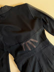 Smoking jumpsuit nera con bottoni dorati