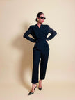 Smoking jumpsuit nera con bottoni dorati