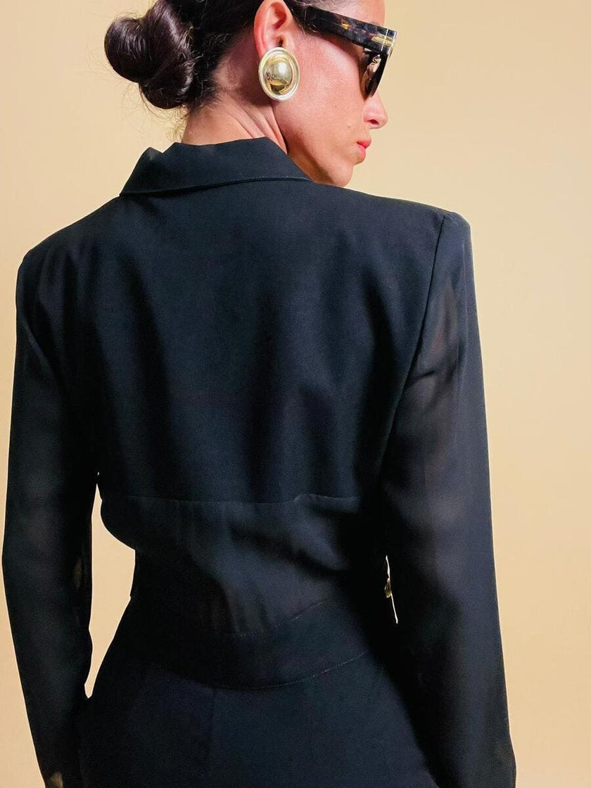 Smoking jumpsuit nera con bottoni dorati