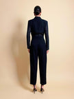 Smoking jumpsuit nera con bottoni dorati