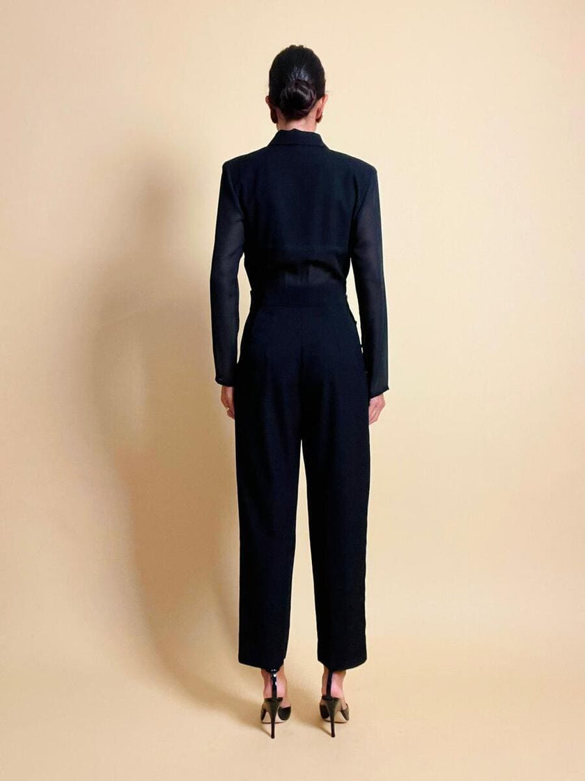 Smoking jumpsuit nera con bottoni dorati