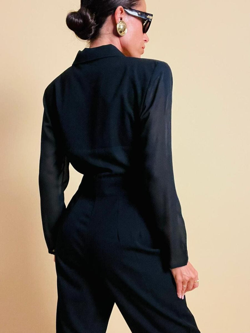 Smoking jumpsuit nera con bottoni dorati